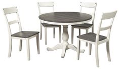 a white table and four chairs sitting next to each other