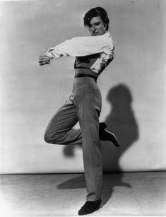 an old photo of a man dancing