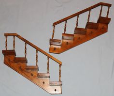 Pair vintage / MCM wall shelves in form of staircase / steps.  Each has 5 steps and 5 pegs. Stair rails are accented with wooden spindles.  Each step measures 4" wide x 3-1/4" deep x 3/4" tall.  Spindles are about 5" tall. Each piece requires a minimum of 16" x 16" wall space.  Back of each has 2 large sawtooth hangers.  Wood is stamped "JN 3:16" There are some minor dings and scratches, as shown in photos.  There is also one step with what appears to be a water stain.  I don't believe any of th Staircase Shelf, Stair Shelf, Railing Shelf, Staircase Shelves, Wall Decor Shelves, Step Shelf, Shelf Rail, Stair Shelves, Step Shelves