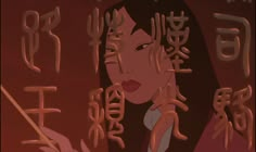 a woman with long black hair and chinese writing on her face in front of a red background