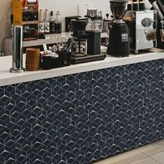 a coffee bar with various types of espresso machines