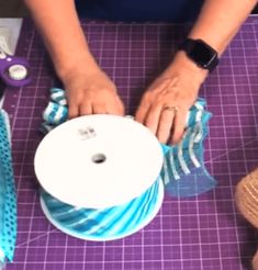 a woman is working on some crafting supplies