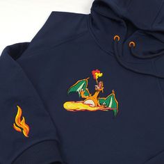 a blue hoodie with an image of a cartoon character on the side and flames coming out of it