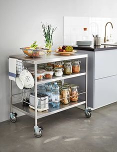 a kitchen cart filled with lots of food