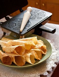 some food is on a green plate with a spatula next to it and an oven in the background