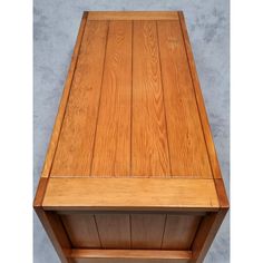 a wooden table with one drawer open