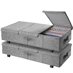 two grey storage boxes with drawers on each side and one open drawer in the middle