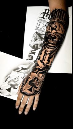 a man's arm with tattoos on it