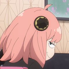 an anime character with pink hair and big eyes looks at something in the distance while sitting down