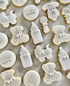 baby shower cookies are arranged on a table