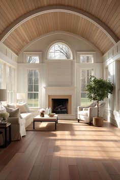 a living room filled with furniture and a fire place in the middle of a room