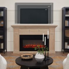 a living room with a fireplace and television on the wall