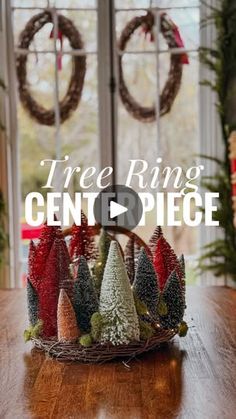 a wooden table topped with christmas trees and wreaths