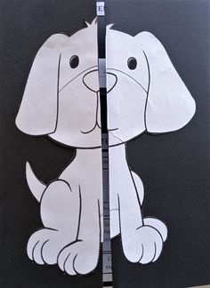 two pieces of paper cut out to look like a dog