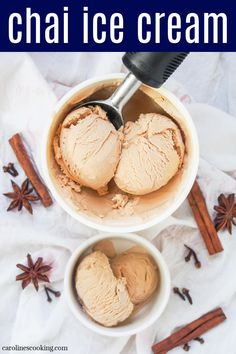 two bowls filled with ice cream next to cinnamon sticks