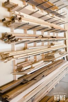 some wooden planks are stacked up on the wall and ready to be used as art