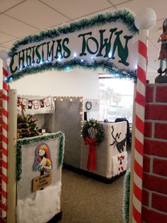 an office decorated for christmas with decorations on the front and side walls, including refrigerators