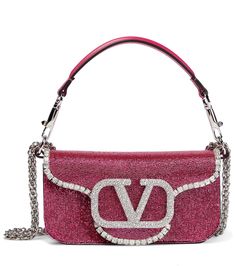 Slated to become Valentino Garavani's new "It" bag, the Loco is a '90s-inspired baguette style. Made from metallic leather, this Small design is embellished with SwarovskiÂ® crystals all-over and accented with VLogo hardware. | Valentino Garavani Loco Small embellished shoulder bag Valentino Garavani Bag, It Bag, Crystal Bags, Small Design, Valentino Bags, Looks Chic, Metallic Leather, Small Designs