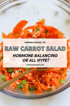 raw carrot salad in a glass bowl with text overlay that reads, raw carrot salad harmone balancing or all hype?