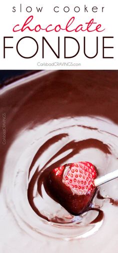 a chocolate fondue with strawberries in the center and text overlay reading slow cooker chocolate fondue