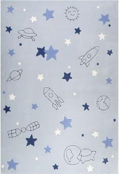 a blue rug with stars and rockets drawn on the ground in front of a sky background