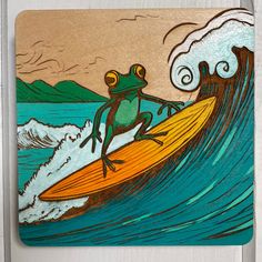 a frog sitting on top of a surfboard in the ocean while riding a wave