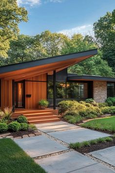 a modern house in the middle of a lush green park