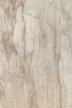 a white marble textured wall with brown streaks