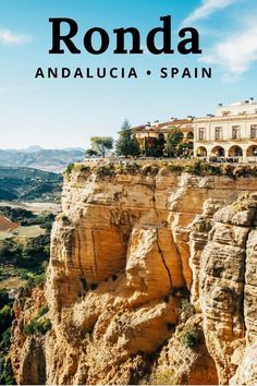 the words ronda andaluca spain in front of a cliff with houses on it