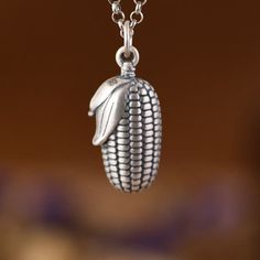 990 Sterling Silver Corn Necklace Pendant, Corn Jewelry, Food Charms, Candy Corn Charms, Halloween Charms, Corn Cob Charm, Food Jewelry  (Not Including Chain) Material: 990 fine silver Weight: 1.8g * We guarantee 100% genuine 990 Sterling Silver, If not we will refund your money. Care Instruction : 1. Avoid contact with all liquids and chemicals, such as perfume, sea water, mayonnaise, ammonia, chlorinated pool water, hair spray and sweat. Contact with these substances will increase the rate at Corn Jewelry, Charms Candy, Water Hair, Corn Seed, Corn Cob, Food Charms, Halloween Charms, Corn On Cob, Food Jewelry