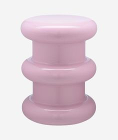 a pink plastic object on a white background