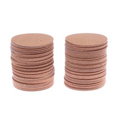 a stack of round cork coasters sitting on top of each other