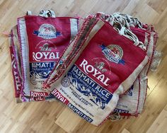 three bags of royal roast sitting on top of a wooden floor next to each other