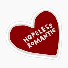 a sticker with the words homeless romantic written on it in white letters and a red heart