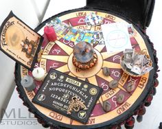 a close up of a board game on a table with other items and decorations around it