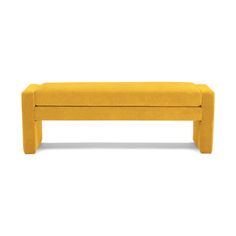 a yellow bench sitting on top of a white floor