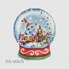 a cross stitch snow globe with santa's sleigh in it