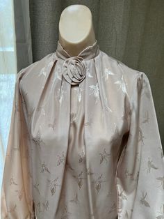 "Pretty sand color dressy blouse is perfect for a professional lady or one part of a formal outfit paired with a dressy skirt or slacks.  No tags of any kind so I am not certain about the size or the fabric.   But I am pretty sure the fabric is a very nice polyester with a matte satin surface.  From the way it fits my size S dress form I would recommend it for a lady who usually wears a size 4 or 6 in a top. Everything about the fabric - texture, color, embossed design - is lovely.  The color is Dressy Skirt, Deep Olive Green, Pretty Butterfly, Fabric Rose, Romantic Blouses, I Am Pretty, Dressy Skirts, Ideas For Outfits, High Neck Blouse