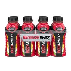 four bottles of body armor strawberry punch on a white background