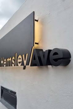 the sign on the side of a building that says shemsley avenue in gold lettering