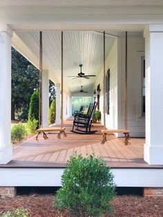 an instagramted photo of a porch with rocking chairs on the front and back porch