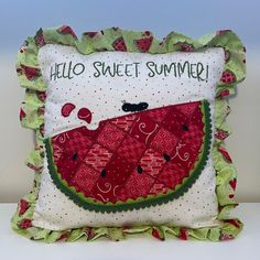 a pillow that has been made to look like a slice of watermelon with the words hello sweet summer on it