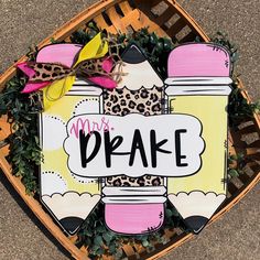 a sign that says mr and mrs bake on top of a basket filled with plants