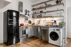 the kitchen is clean and ready to be used as a washer and dryer