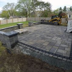 an outdoor patio is being built in the back yard