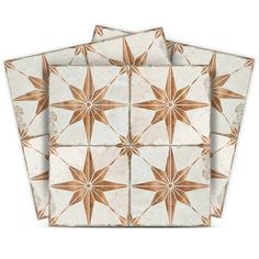 three white and brown star patterned placemats