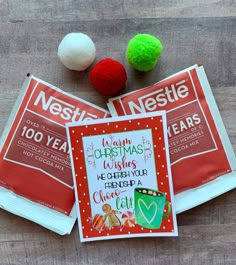 three christmas cards and two pom poms on top of each other with the words nestle