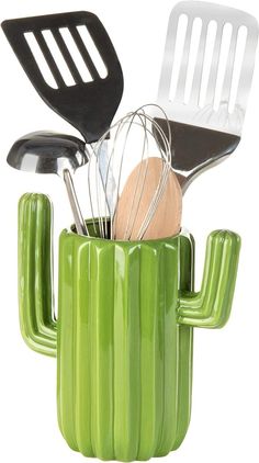 a green cactus shaped container with utensils in it