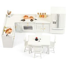 a model kitchen with white furniture and appliances