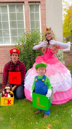 three people dressed up as mario and princess peach in front of a house with two children